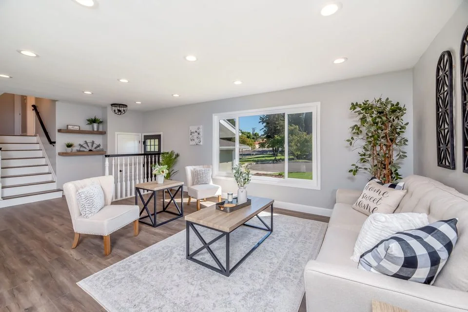 Open-plan living and dining space with large windows